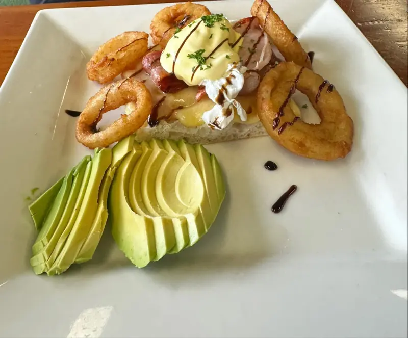 Fresh avocado smash with feta and cherry tomatoes on sourdough